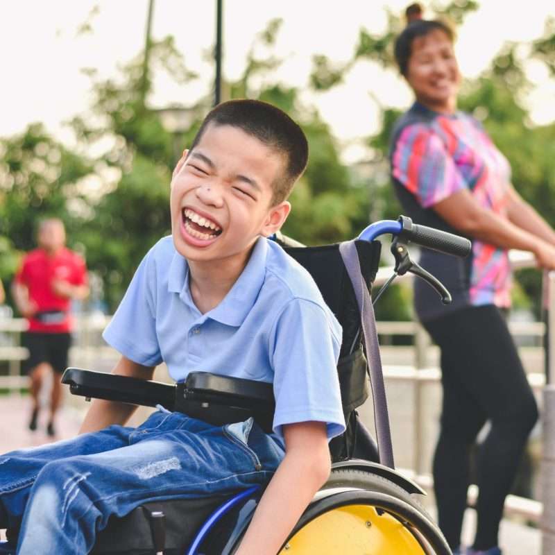 Handicapped child having fun in park