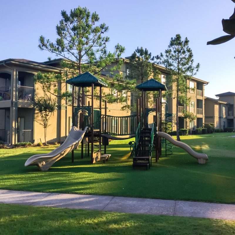 Beige and green playground structure